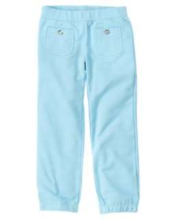 Knit pants have elastic at the ankle and clear gem buttons on the 