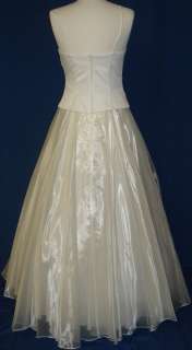   dress ball gown the color is ivory the dress is made from satin bodice