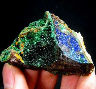  and malachite resting on the dull gray base rock the azurite crystals