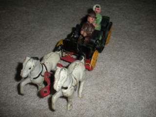 CASE IRON HORSE AND CARRIAGE WITH PEOPLE  